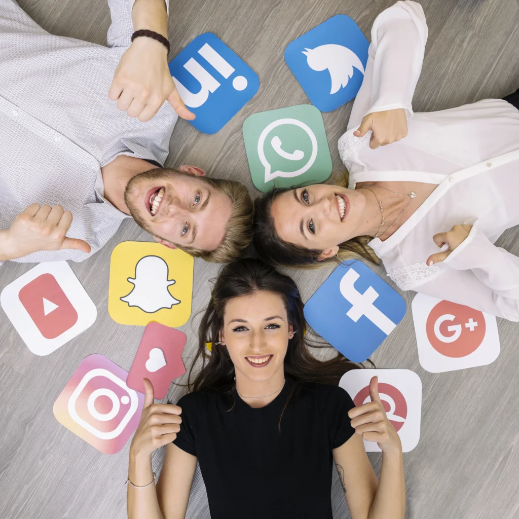young smiling friend lying floor with social media logos showing thumbup sign young smiling friend lying floor with social media logos showing thumbup sign